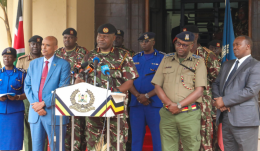 Police address the public ahead of the Nane Nane march.